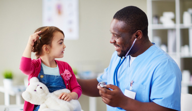 Nurse attending to a child